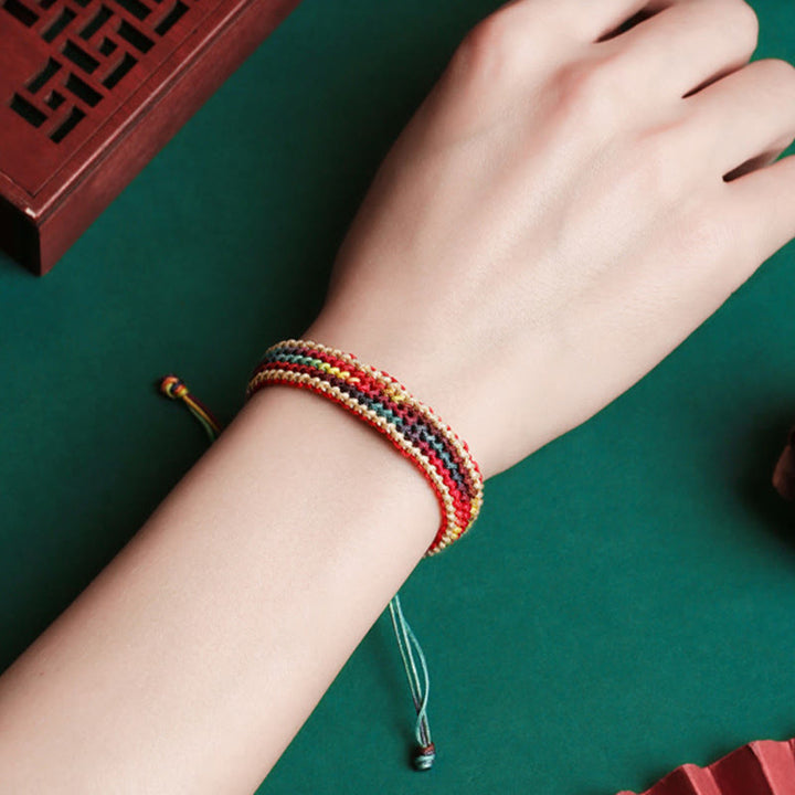 Bracelet tressé de protection multicolore arc-en-ciel fait main en Buddha Stones tibétaines
