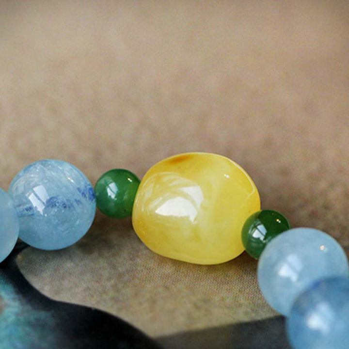 Bracelet de guérison et de sérénité en perles d'ambre et d'aigue-marine naturelles
