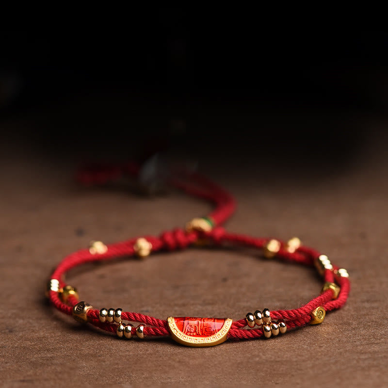 Bracelet en corde rouge tressée porte-bonheur en forme de boulettes de cinabre faites à la main par Buddha Stones