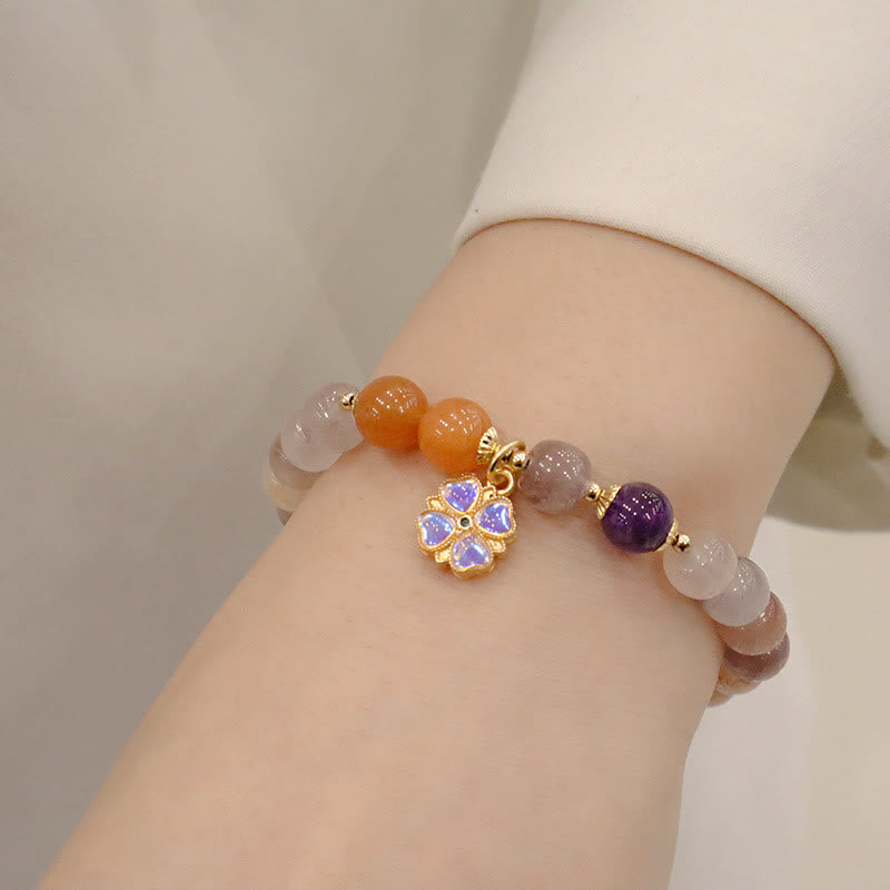 Bracelet de richesse en perles de jade violet doré en Buddha Stones