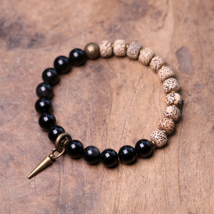 Bracelet de paix en cuivre et bois d'ébène avec Buddha Stones et graines de Bodhi tibétaines