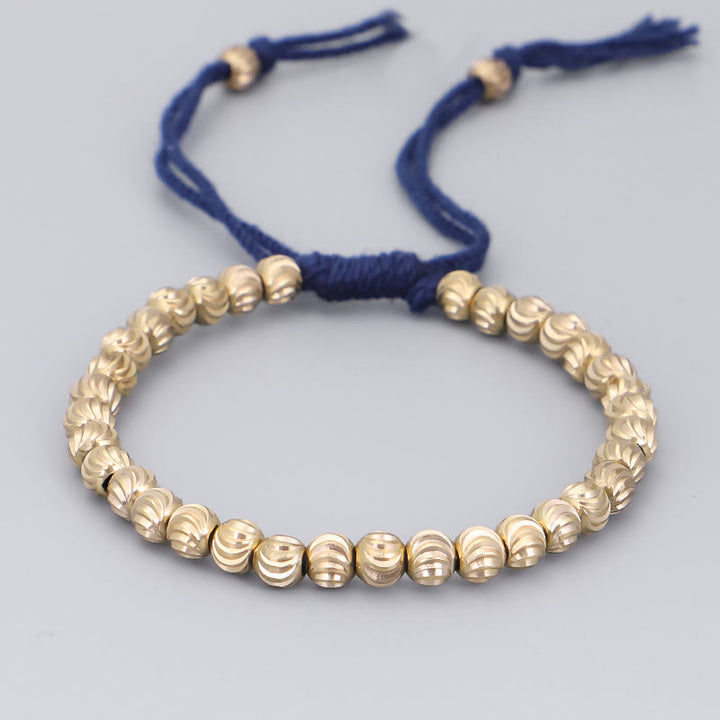 Bracelet porte-bonheur en perles de cuivre tibétaines faites à la main avec Buddha Stones