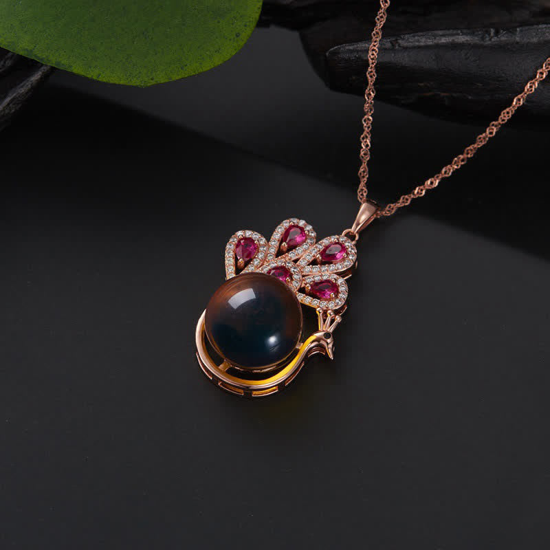 Collier pendentif et bague en ambre avec symbole de la fortune et de l'amour