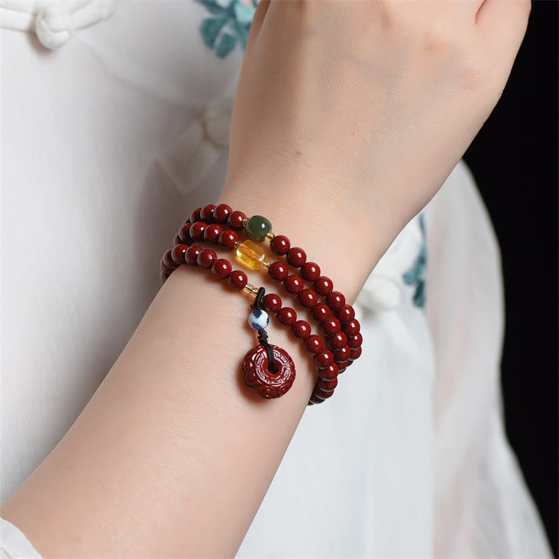 Bracelet Mala tibétain à triple tour avec boucle de paix et Buddha Stones