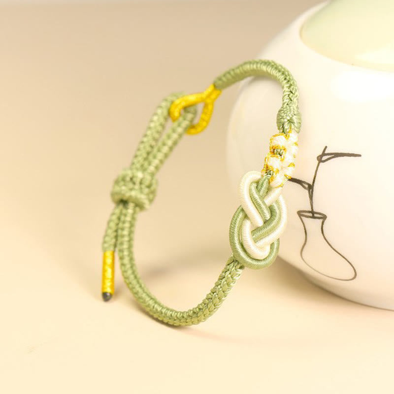 Bracelet de connexion porte-bonheur en forme de nœud de paix à huit fils fabriqué à la main par Buddha Stones