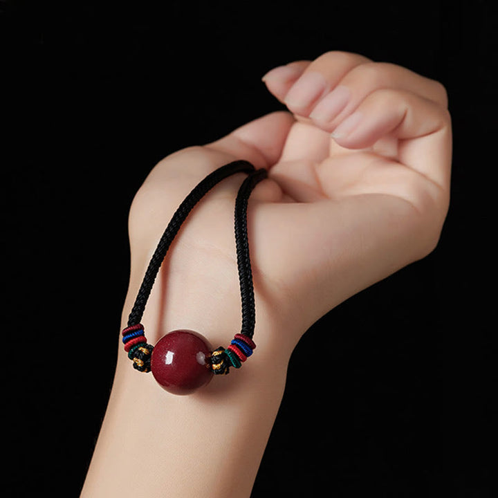 Collier avec pendentif en perles de cinabre et Buddha Stones