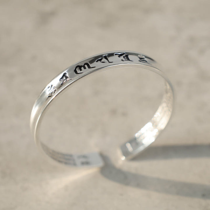Bracelet en cuivre blanc avec mantra tibétain et Buddha Stones