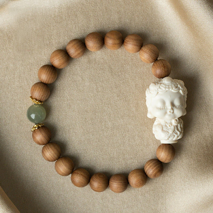 Bracelet de protection Tara verte en Buddha Stones en bois de santal et jade Hetian