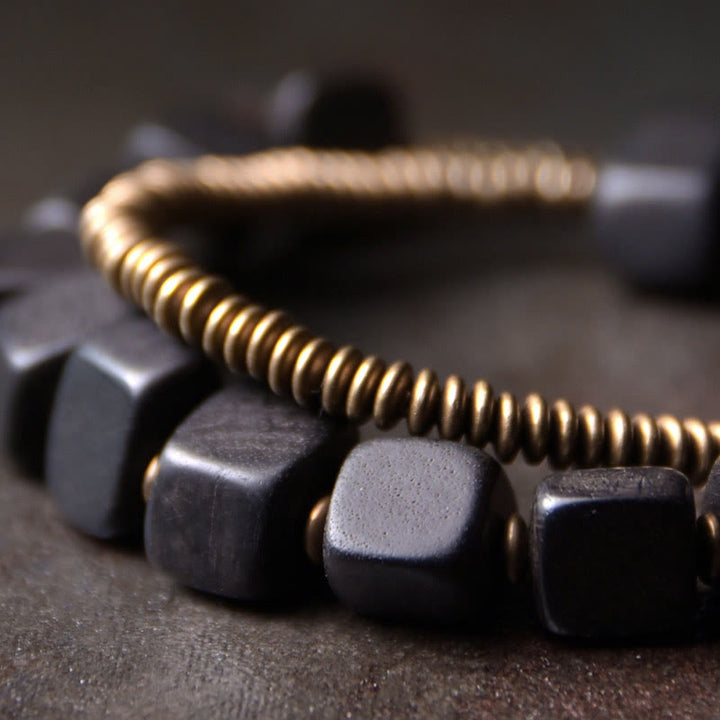Bracelet double tour en cuivre et bois d'ébène tibétain avec Buddha Stones