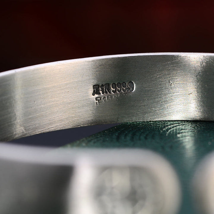 Bracelet Feng Shui en Buddha Stones avec cinq pièces de monnaie de l'empereur et cacahuètes