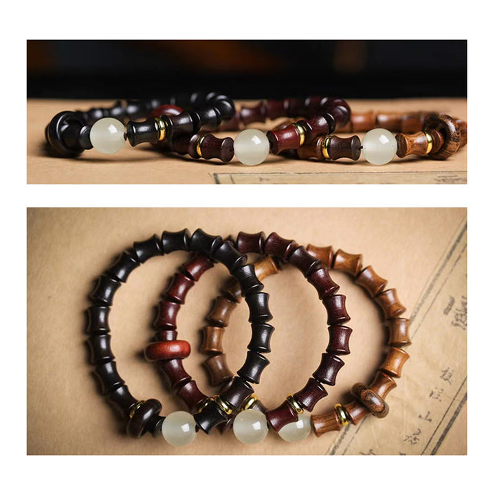 Bracelet de paix en bambou et bois de santal vert et ébène avec Buddha Stones