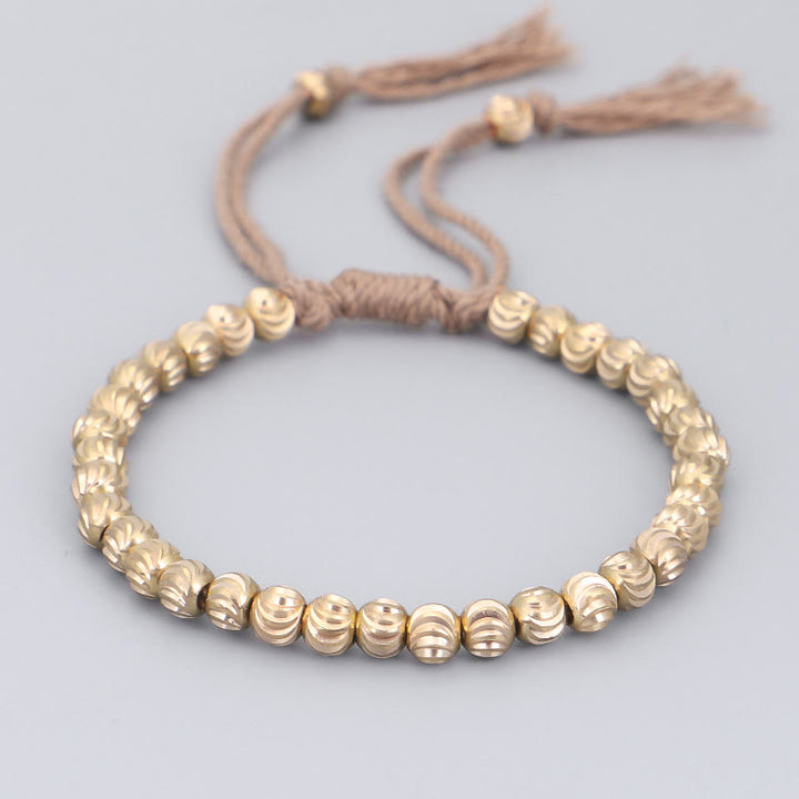 Bracelet porte-bonheur en perles de cuivre tibétaines faites à la main avec Buddha Stones