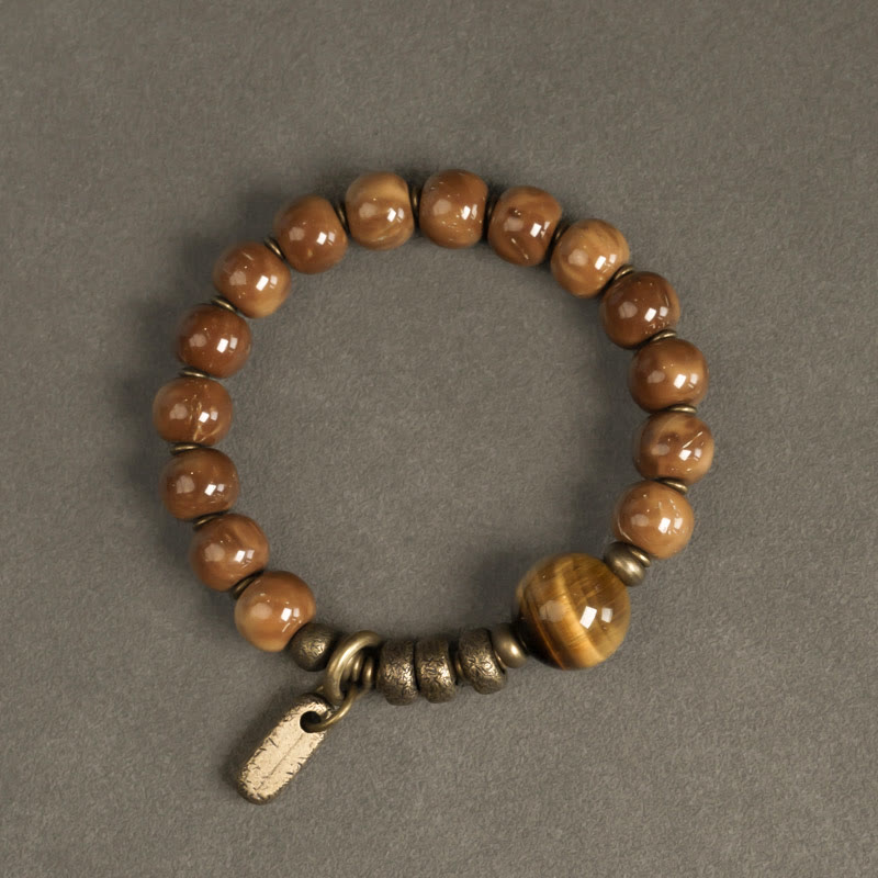 Bracelet porte-bonheur en cuivre et obsidienne dorée avec Buddha Stones de Kuka et œil de tigre