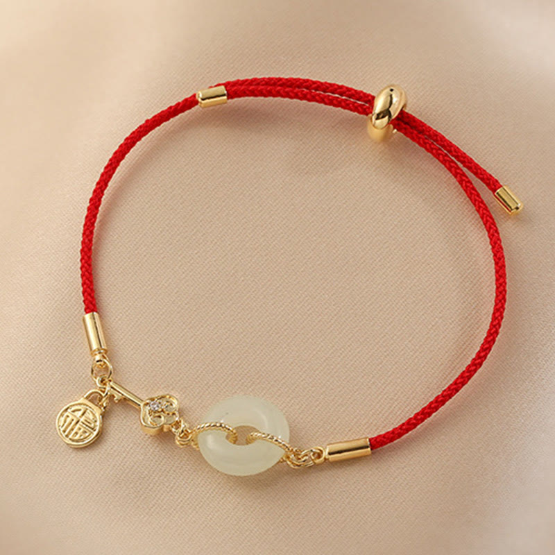Bracelet en corde rouge avec boucle de paix en jade Hetian plaqué or 18 carats et Buddha Stones