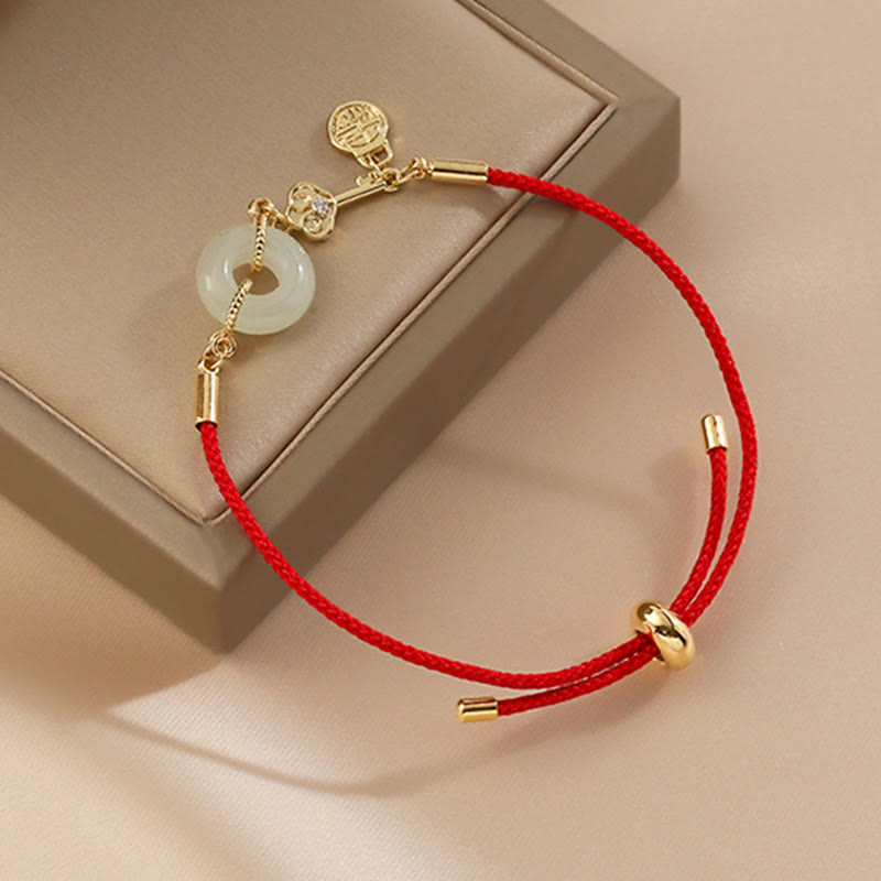 Bracelet en corde rouge avec boucle de paix en jade Hetian plaqué or 18 carats et Buddha Stones