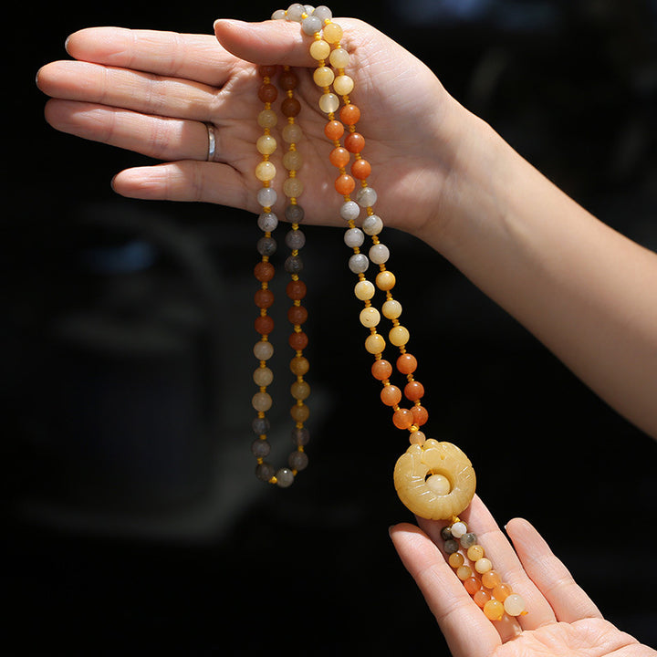 Collier pendentif tibétain en jade doré et soie Buddha Stones