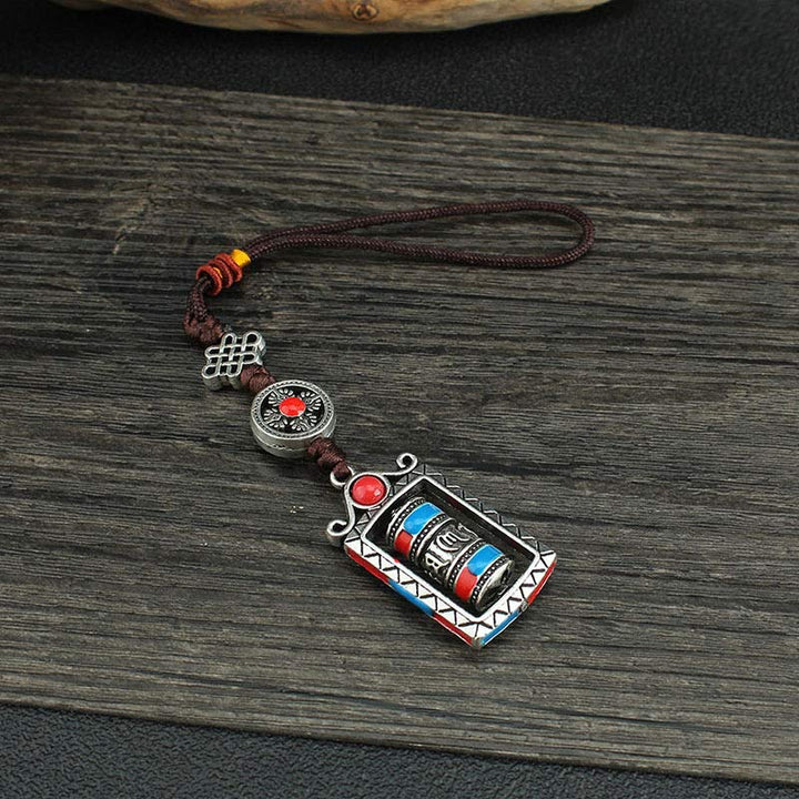 Porte-clés décoratif avec nœud rotatif et bénédiction en forme de roue de prière en six mots vrais en Buddha Stones