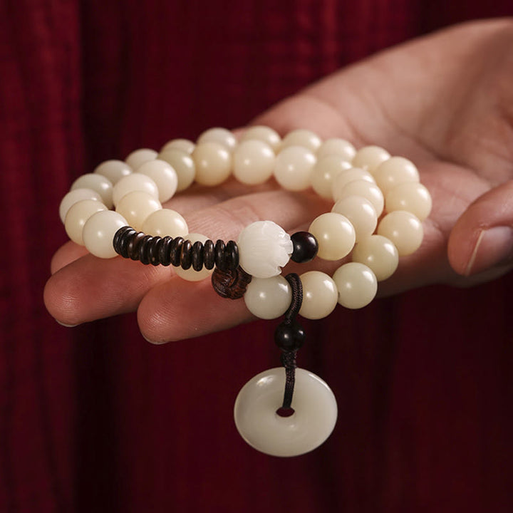 Bracelet double tour en harmonie avec boucle de paix en bois de santal vert et graines de Bodhi et Buddha Stones