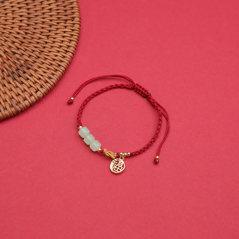 Bracelet porte-bonheur en corde rouge avec perles de jade fabriquées à la main par Buddha Stones