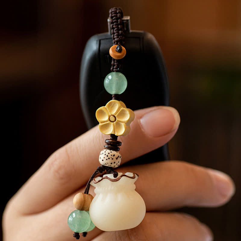 Buddha Stones Sac d'argent de graines de Bodhi naturel Porte-clés de bénédiction de fleur de prospérité