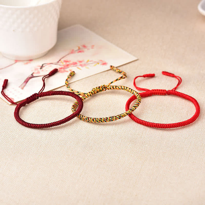 Bracelet tibétain porte-bonheur avec 3 Buddha Stones et cordon rouge