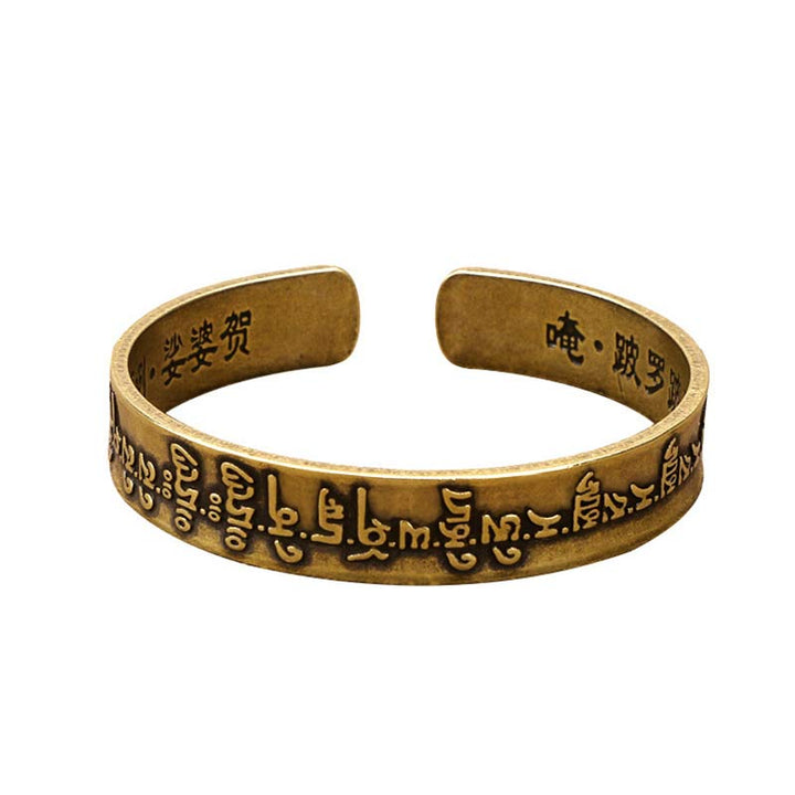 Bracelet de guérison en cuivre et laiton avec Buddha Stones et mantra tibétain Mahāpratisarā sanskrit