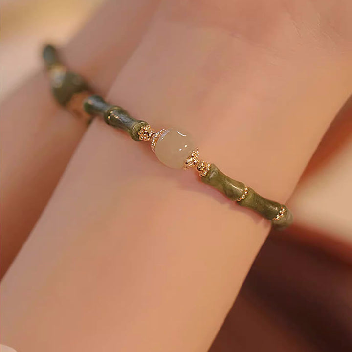 Bracelet porte-bonheur en jade Hetian péridot plaqué cuivre 14 carats avec Buddha Stones et motif bambou