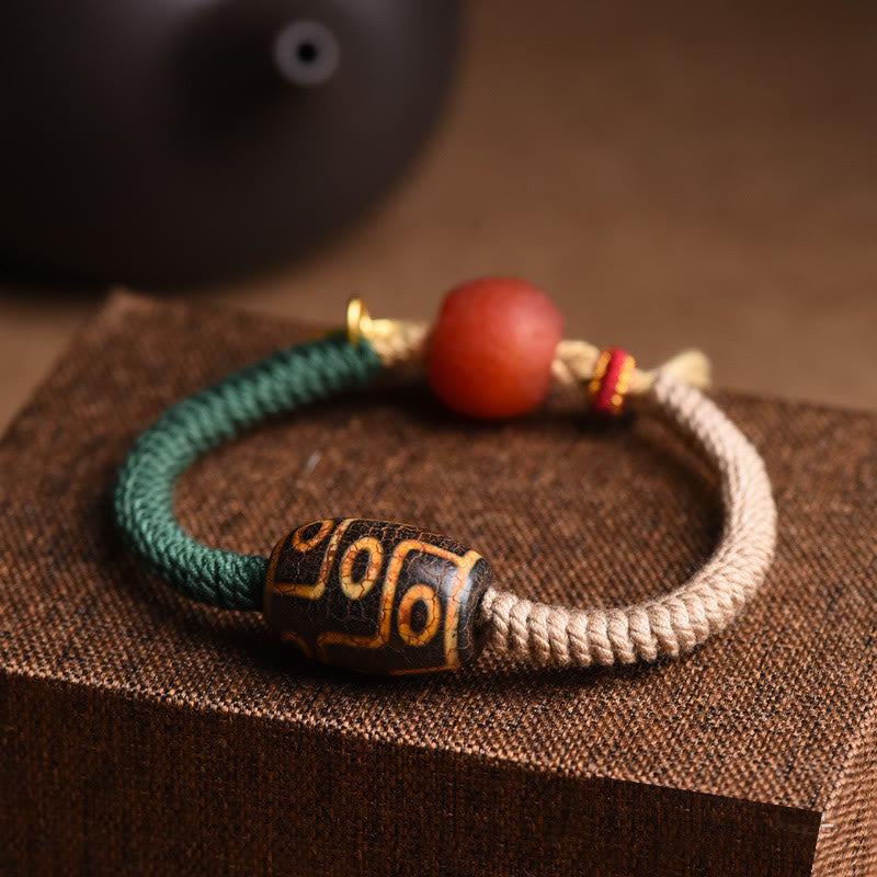 Bracelet en corde de richesse en perles tibétaines à neuf yeux Dzi fait main par Buddha Stones