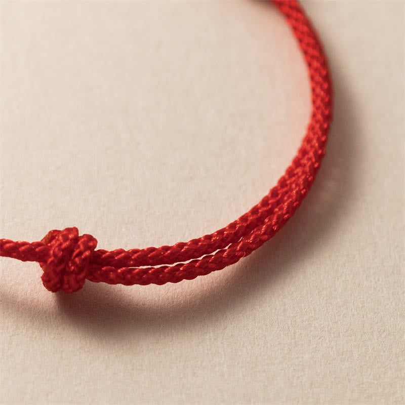 Bracelet tressé rouge sculpté à la main en argent sterling 925 de Buddha Stones Année du Dragon