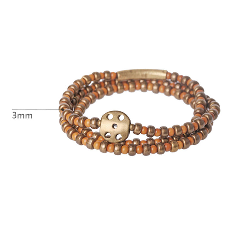 Bracelet de richesse rétro en cuivre avec noyau d'olive et Buddha Stones