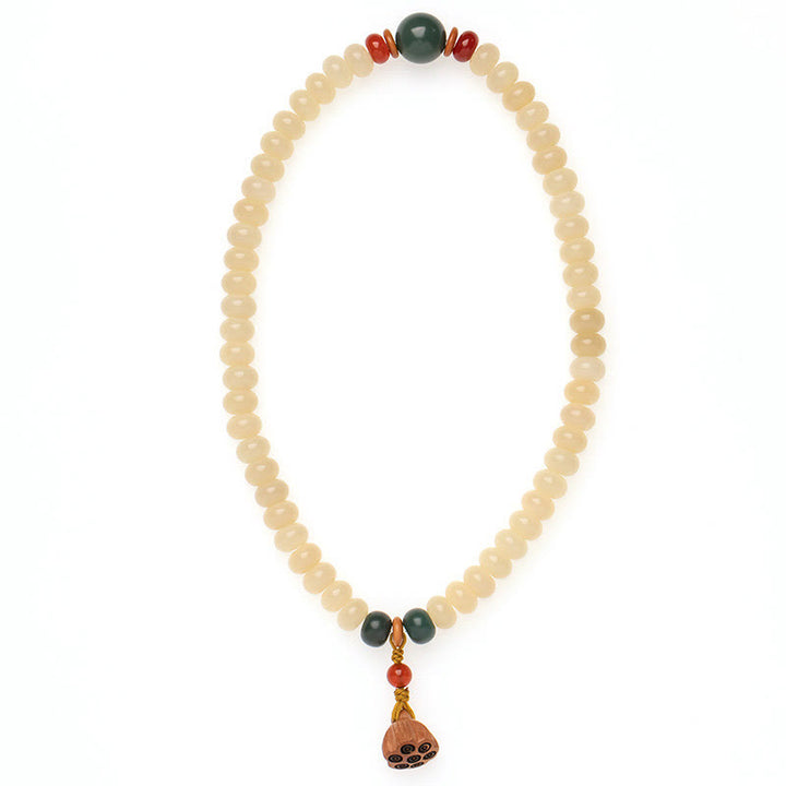 Bracelet double tour avec breloque en forme de gousse de lotus et graines de Bodhi et Buddha Stones