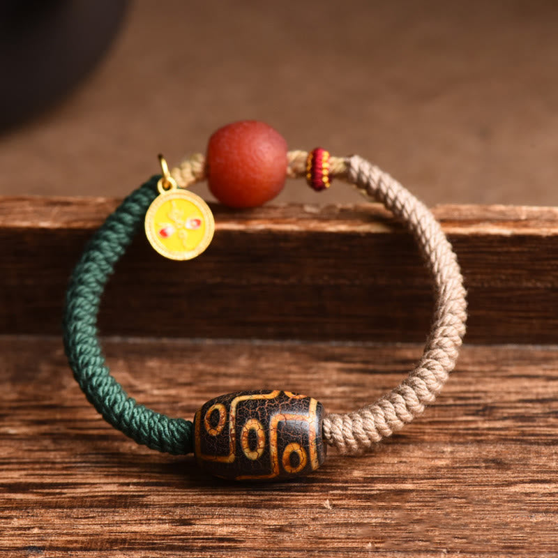 Bracelet en corde de richesse en perles tibétaines à neuf yeux Dzi fait main par Buddha Stones