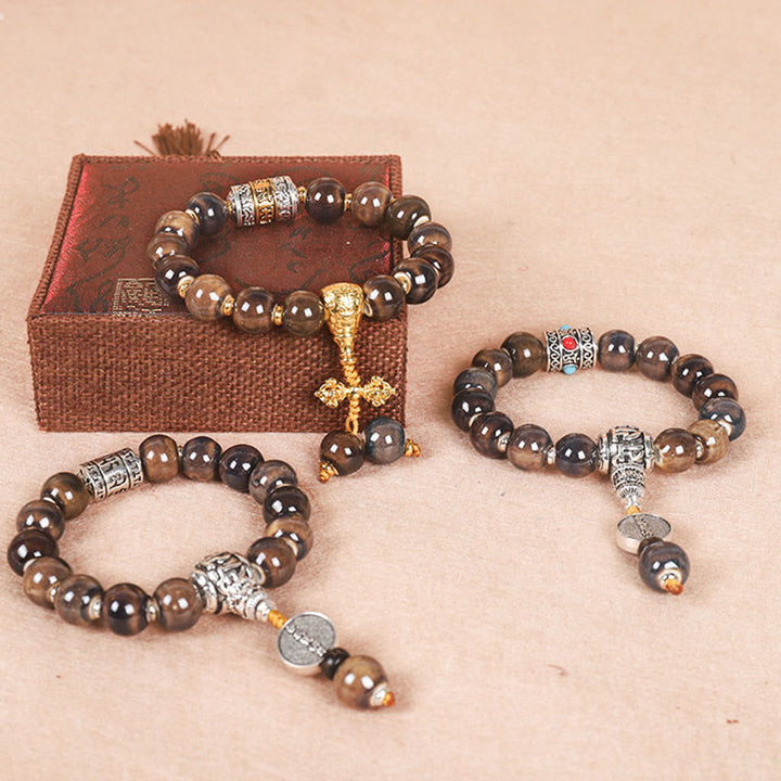 Bracelet de sagesse en perles de verre gravées Buddha Stones et roue de prières tibétaines Om Mani Padme Hum Dorje Vajra