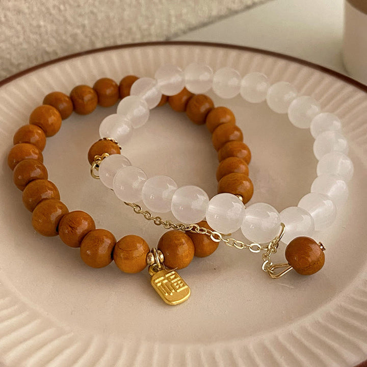 Bracelet de protection à breloques en bois de santal et œil de chat Fu avec Buddha Stones
