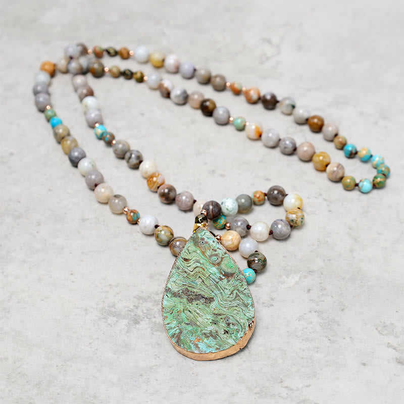 Collier de guérison en perles de jaspe Picasso naturel de l'océan Buddha Stones