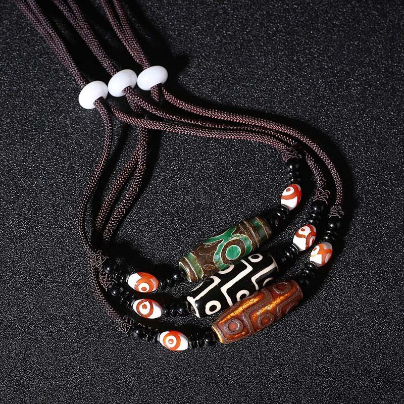 Collier de protection en perles tibétaines à neuf yeux Dzi Buddha Stones