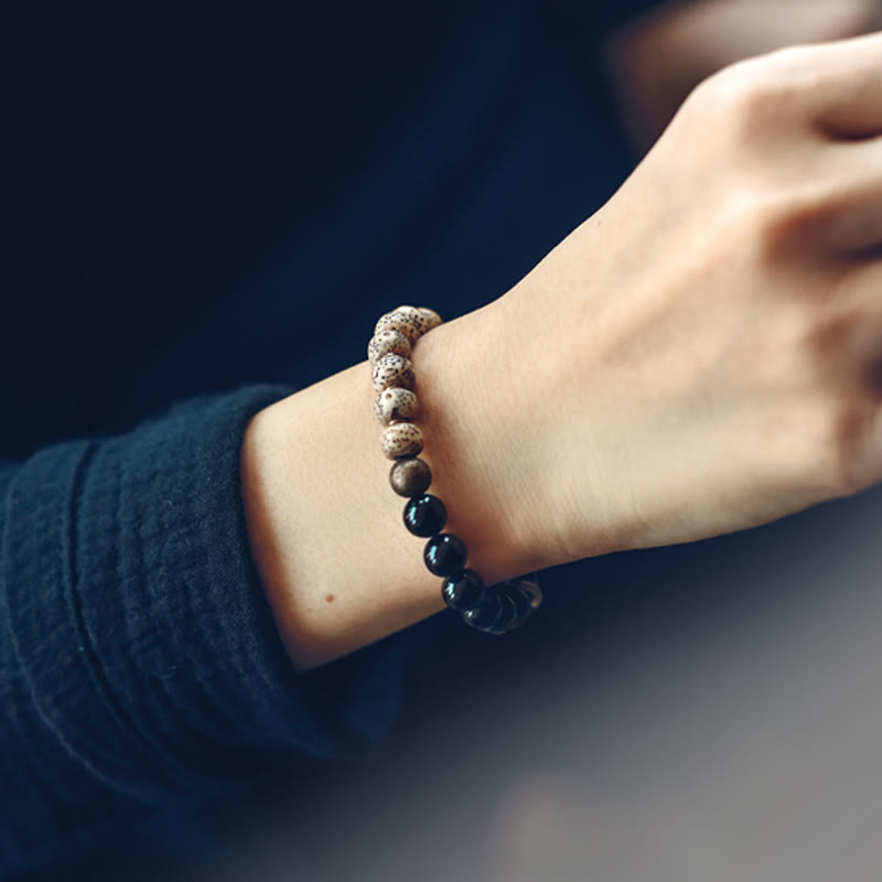 Bracelet de paix en cuivre et bois d'ébène avec Buddha Stones et graines de Bodhi tibétaines