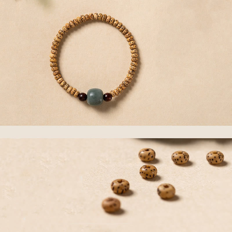 Bracelet de sagesse en bois de santal rouge à petites feuilles et Buddha Stones