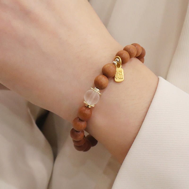 Bracelet de protection à breloques en bois de santal et œil de chat Fu avec Buddha Stones