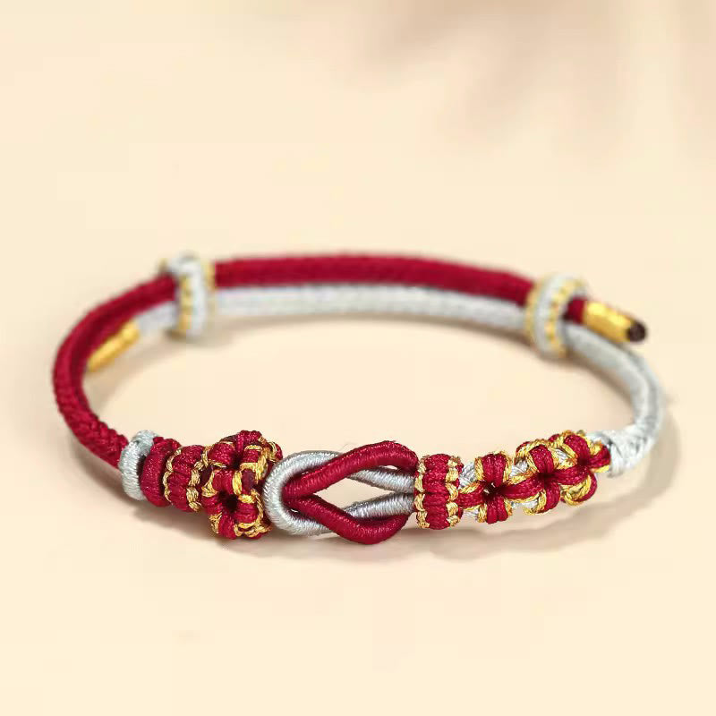 Bracelet de protection porte-bonheur fait main en Buddha Stones avec nœud en fleur de pêcher à huit fils