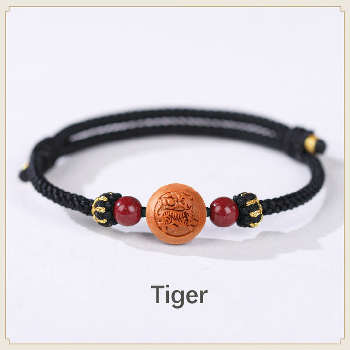 Bracelet de richesse en bois de pêche naturel Buddha Stones et caractère Fu du zodiaque chinois sculpté en cinabre