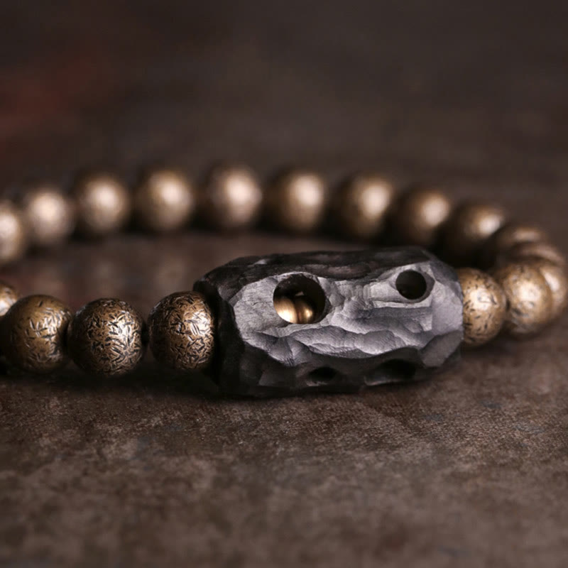 Bracelet de perles en bois d'ébène et cuivre avec Buddha Stones et équilibre