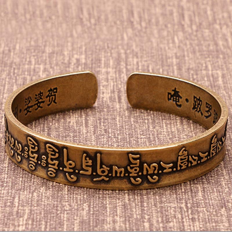 Bracelet de guérison en cuivre et laiton avec Buddha Stones et mantra tibétain Mahāpratisarā sanskrit