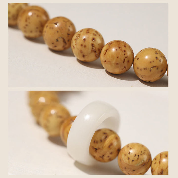 Bracelet double tour en Buddha Stones tibétaines naturelles violettes et dorées avec graines de Bodhi et de richesse