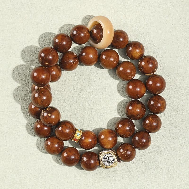 Bracelet double tour en Buddha Stones tibétaines naturelles violettes et dorées avec graines de Bodhi et de richesse