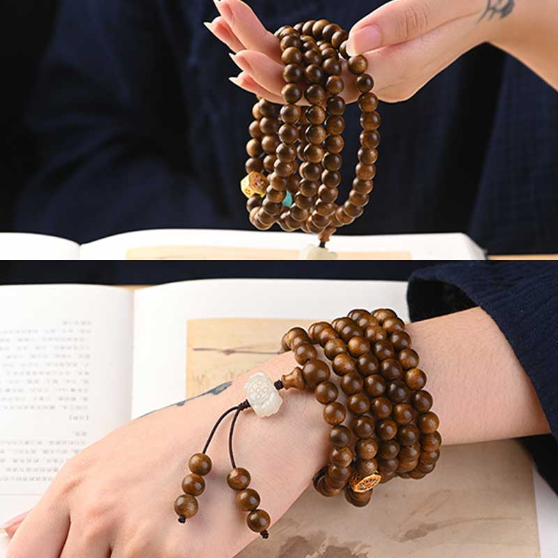 Bracelet Mala tibétain de protection et de calme en bois de rose avec Buddha Stones