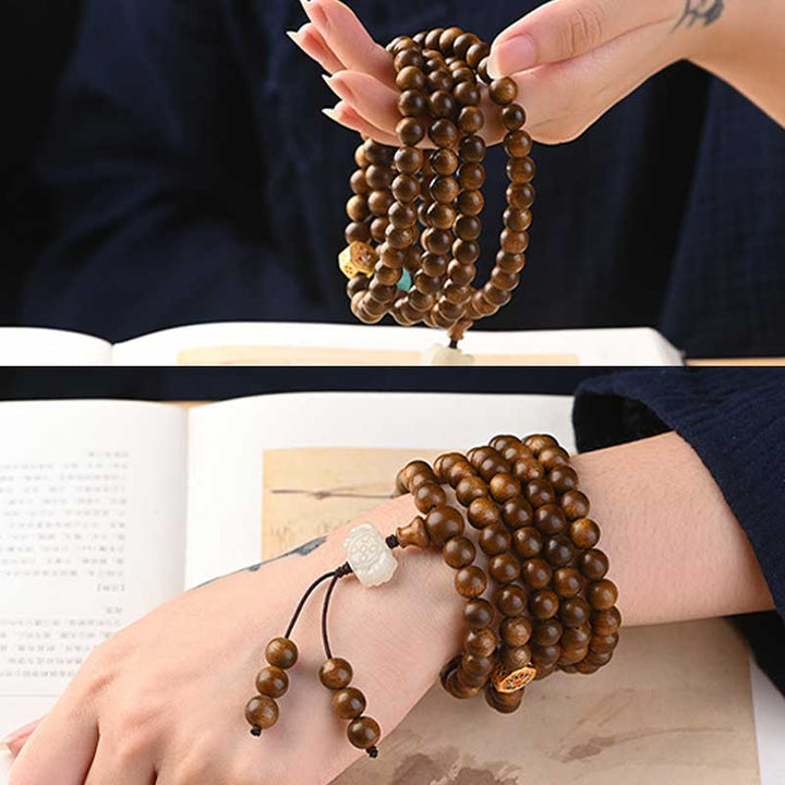 Bracelet Mala tibétain de protection et de calme en bois de rose avec Buddha Stones
