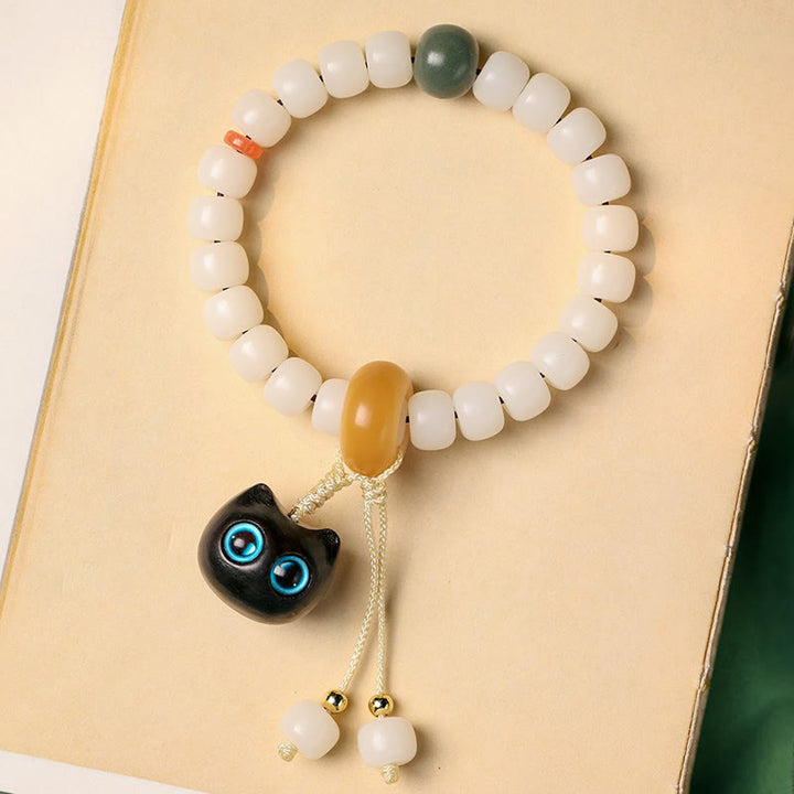 Bracelet en Buddha Stones en graines de Bodhi naturelles en bois noir africain avec joli chat et breloque pour la paix et l'harmonie - image 7