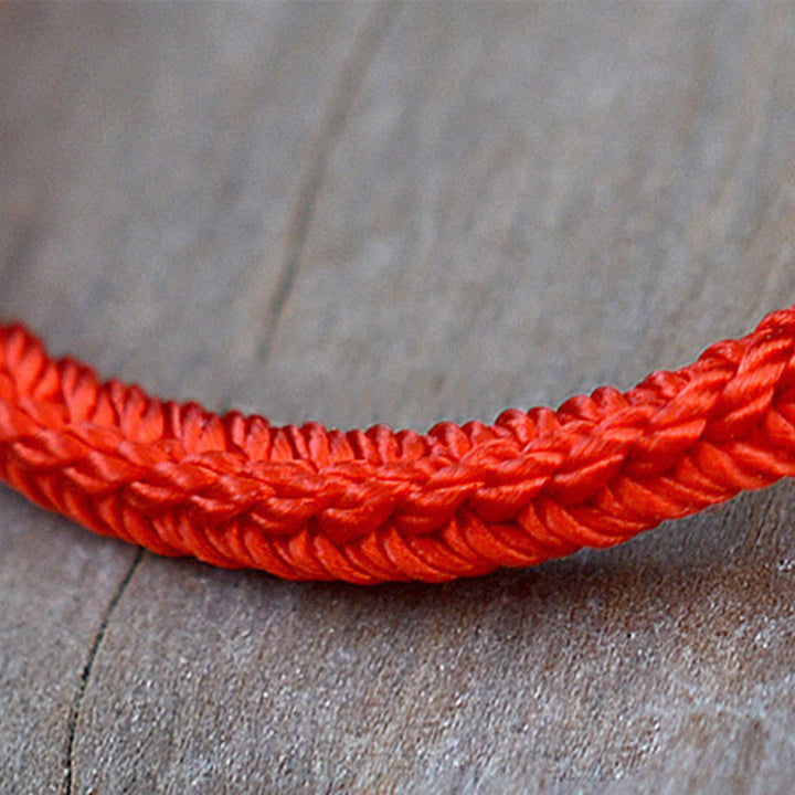 Bracelet tibétain en corde tressée à huit fils avec nœud de paix et protection fait main en Buddha Stones