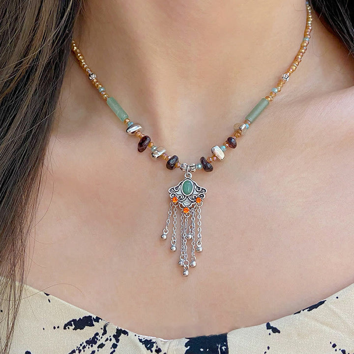 Collier pendentif pompon porte-bonheur en cuivre avec pierres de cristal tibétaines de Buddha Stones